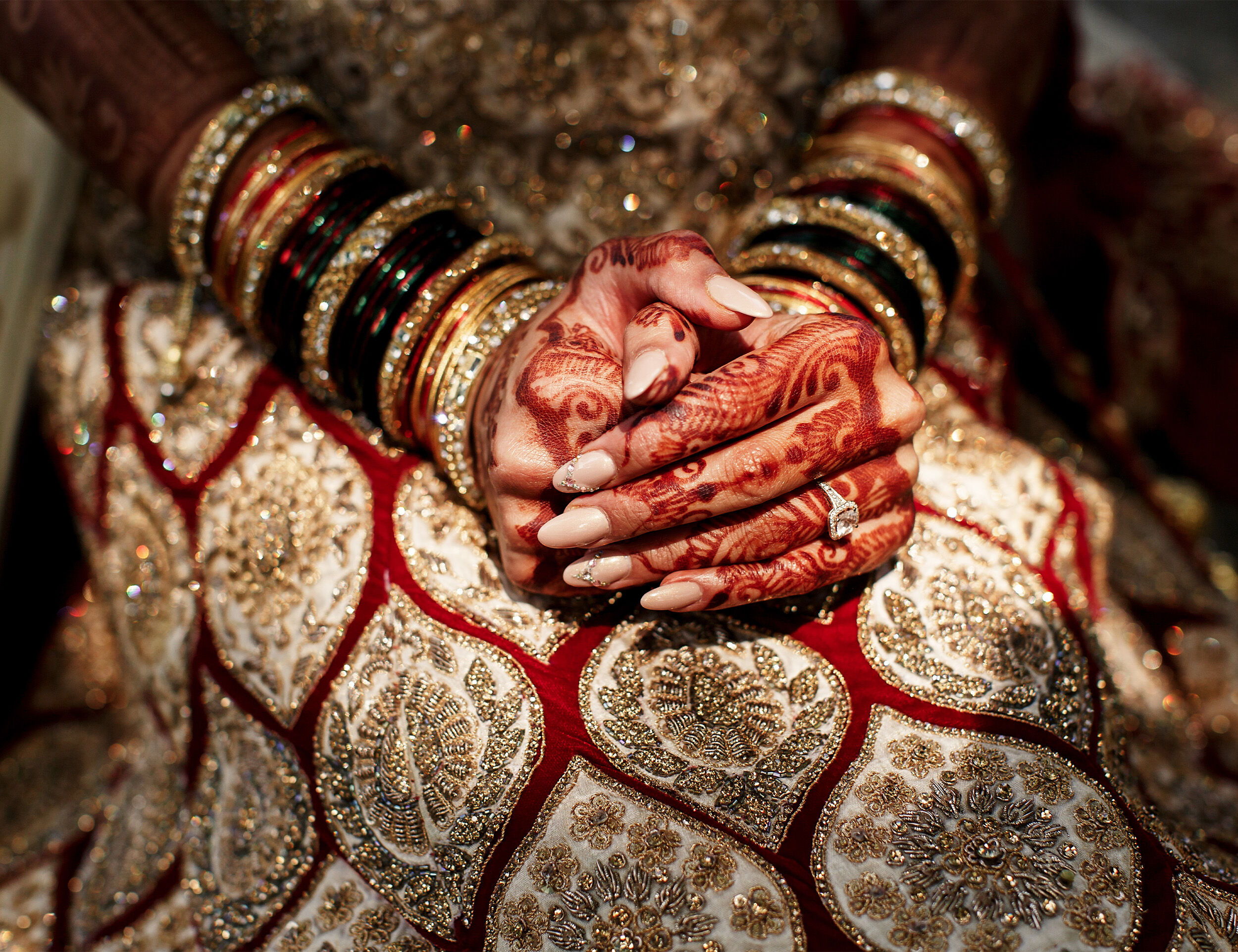 A bride sitting in red lehenga for marriege